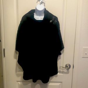 Calvin Klein black cable knit poncho. Rounded bottom hem. Just below hips.